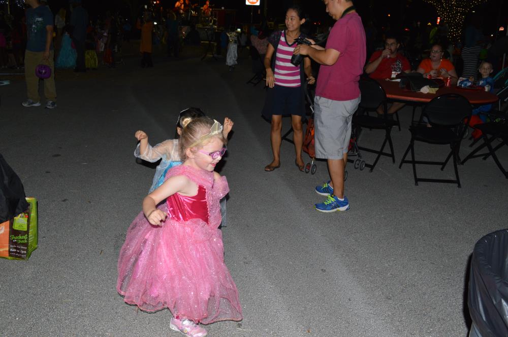 Girl dressed in blue dress and girl dressed in pink dress play